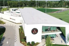 Thumbnail for Aerial view of the Atlanta United FC training ground with modern facilities and adjacent soccer fields.
