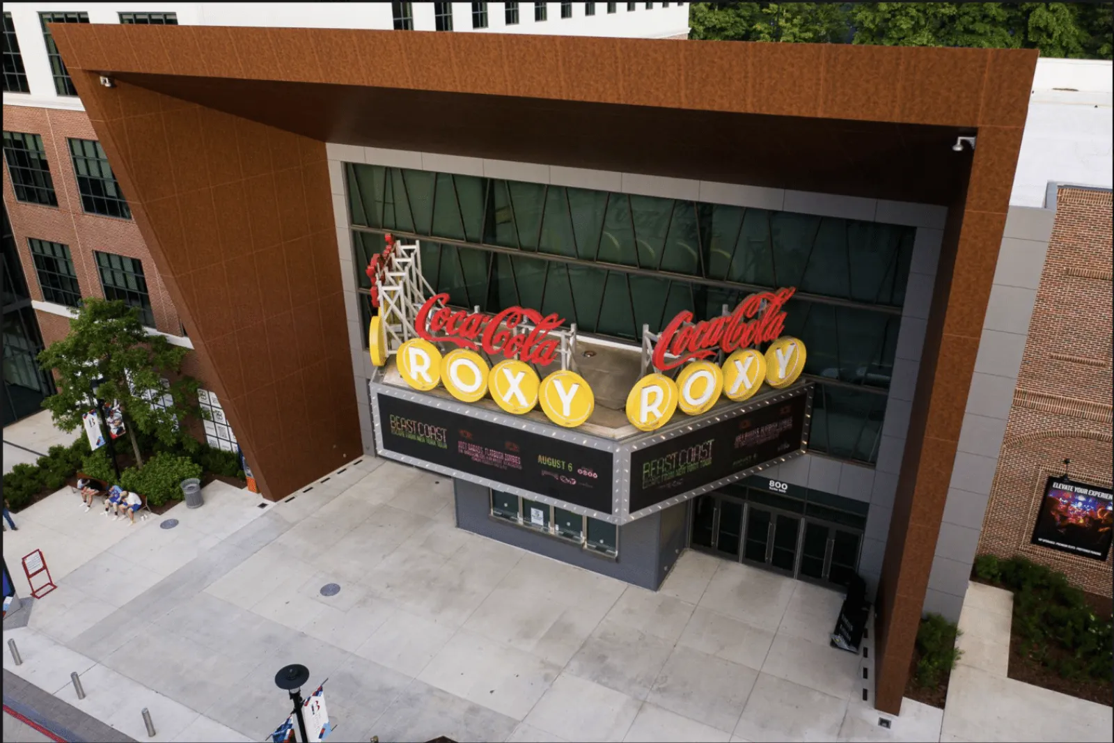 Coca-Cola Roxy theater entrance with large marquee sign and modern architectural canopy above sidewalk.